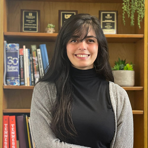 Headshot photo of Eminé Fidan